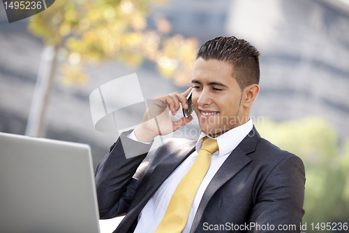 Image of Businessman working at the city park