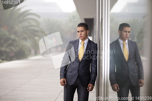 Image of Businessman next to the office door