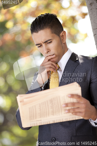 Image of Businessman reading the newspaper