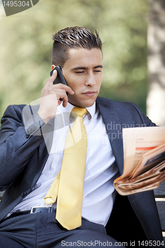 Image of Businessman working at the park