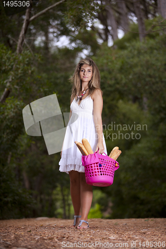 Image of Woman with bread in the basket