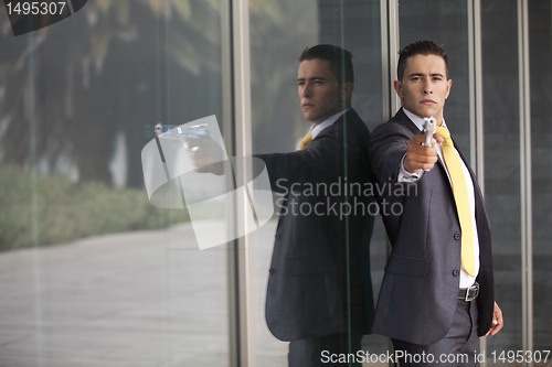 Image of Security Businessman with a handgun