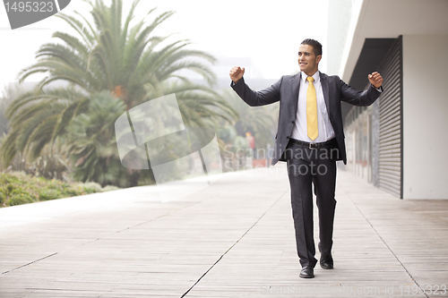 Image of Confident businessman walking