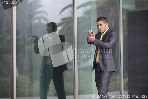 Image of Security Businessman with a handgun