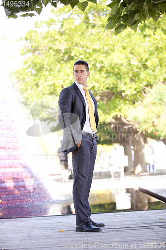 Image of Modern businessman at the city park