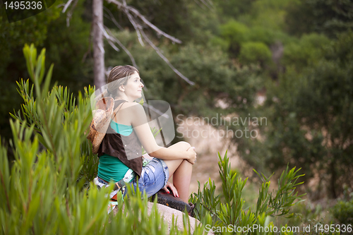 Image of Woman hiking at the forest