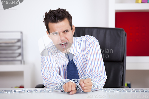 Image of Businessman captive at his office