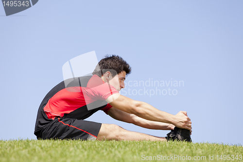 Image of Athlete warming and stretching