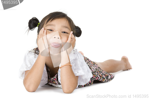 Image of cute Asian girl sticking tongue out