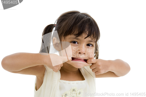 Image of cute little kid making a grimace