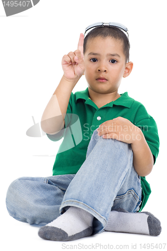 Image of boy with one finger raised