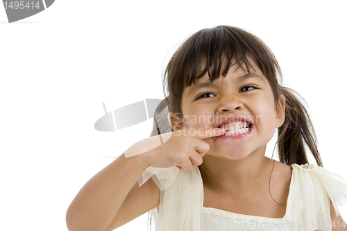 Image of cute little kid showing her teeth