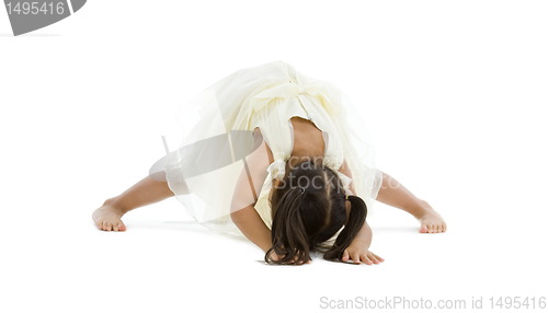 Image of little girl trying to do the splits