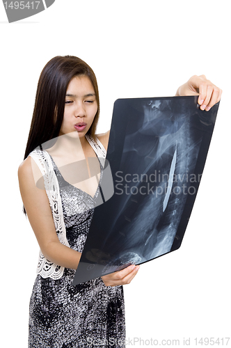 Image of concerned woman with x-ray