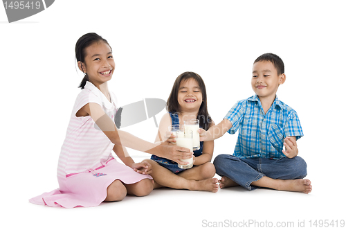 Image of siblings cheering with milk, isolated on white background