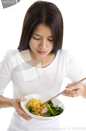 Image of asian woman eating with chop sticks