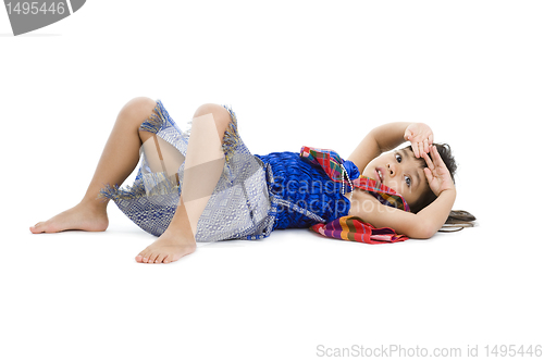 Image of cute little girl laying on the floor