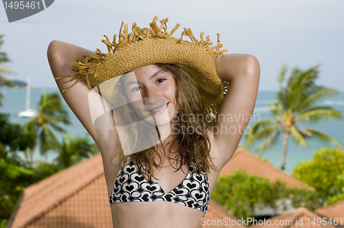 Image of teenager in front of a holiday resort