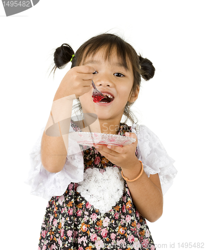 Image of cute girl having sweet dessert