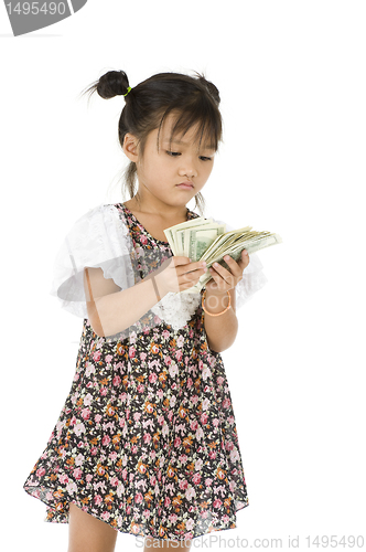 Image of little girl counting us dollars