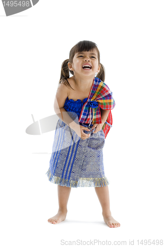 Image of little girl in traditional thai laughing