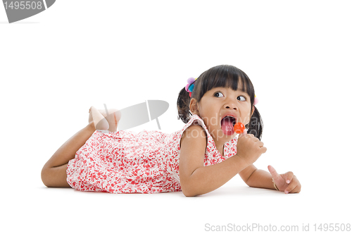 Image of cute little girl with a lollipop