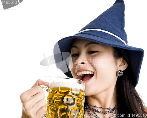 Image of beautiful woman celebrating with beer
