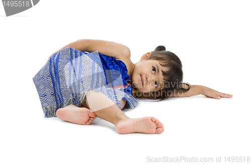 Image of cute little girl laying on the floor