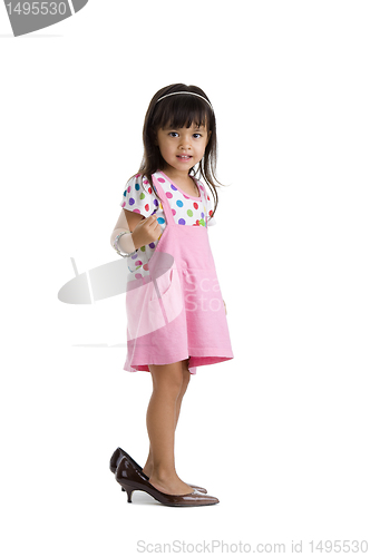 Image of little girl with oversized shoes