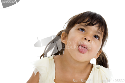 Image of beautiful little girl sticking her tongue out