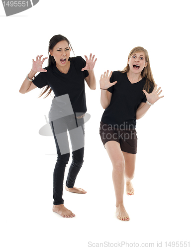 Image of asian and caucasin woman with funny pose