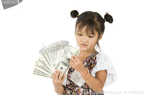 Image of little girl counting us dollars