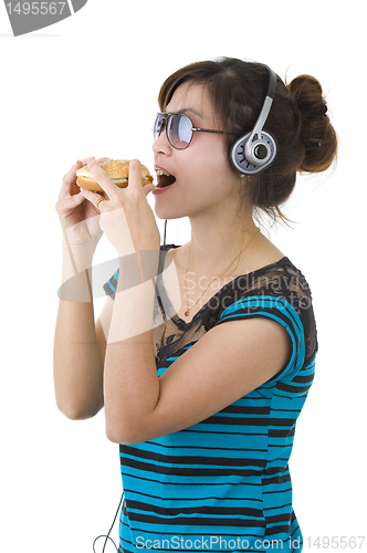 Image of  woman with hamburger, sunglasses and head phones
