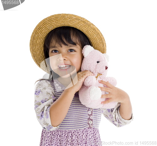 Image of cute little girl with pink teddy bear