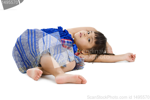 Image of cute little girl laying on the floor