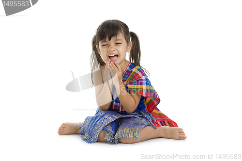 Image of little girl in traditional thai laughing