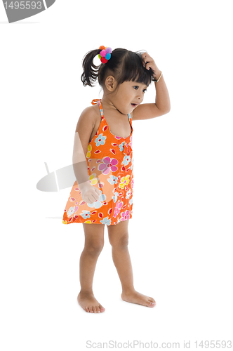 Image of confused girl scratching her head