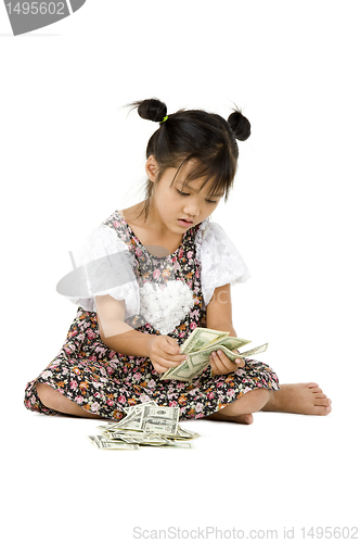 Image of girl sitting on floor and counting money