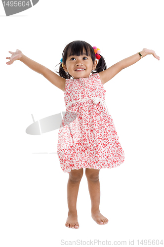 Image of girl in studio with arms outstretched