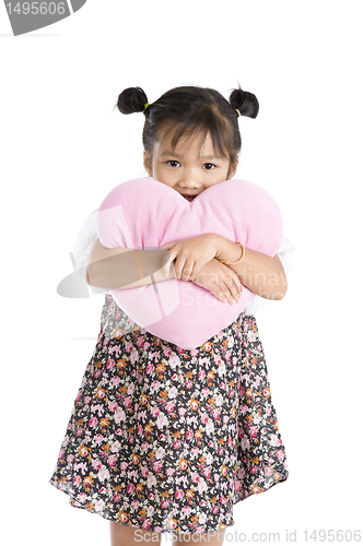 Image of girl with heart shaped pillow