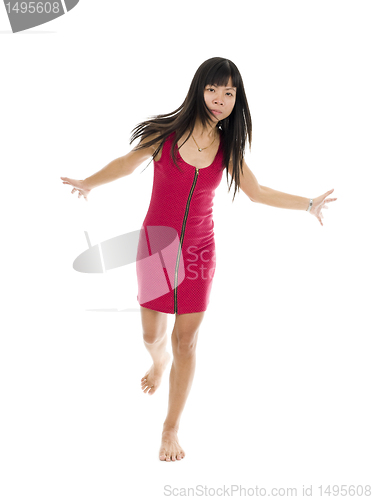 Image of Asian woman in action on one leg