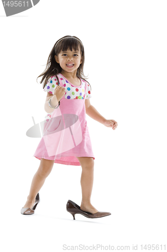 Image of little girl with oversized shoes