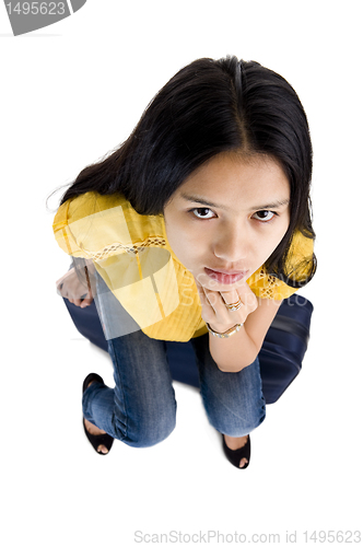 Image of pretty woman sitting on a bag