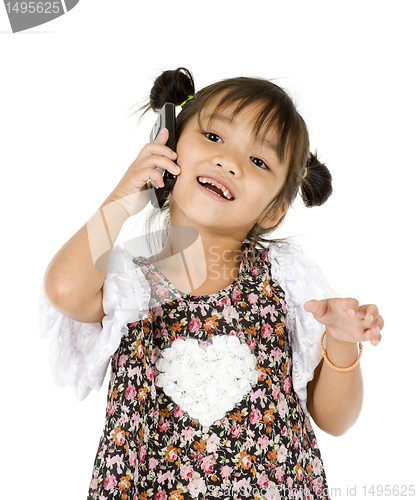 Image of happy little girl on the phone