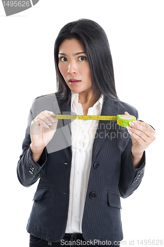 Image of business woman with ruler 