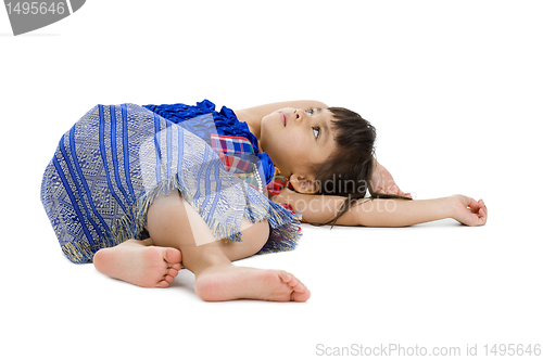 Image of cute little girl laying on the floor