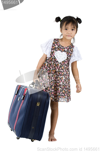 Image of small girl with big suitcase