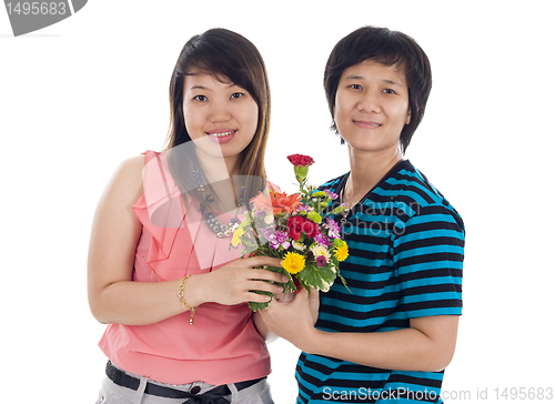 Image of two asian women with flowers