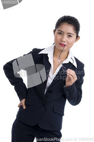 Image of business woman holding her glasses