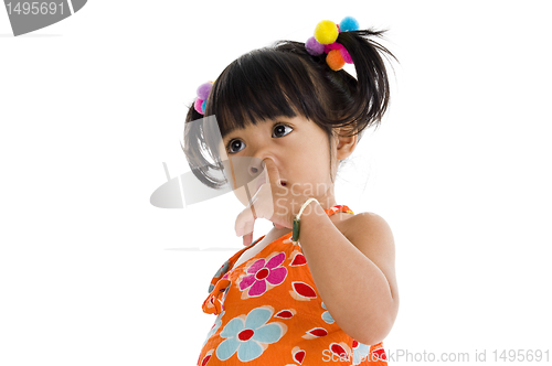 Image of Little girl picking her nose